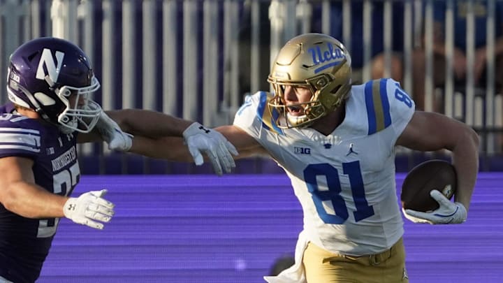 Sep 27, 2025; Evanston, Illinois, USA; UCLA Bruins tight end Hudson Habermehl (81) catches a pass as Northwestern Wildcats linebacker Mac Uihlein (37) defends him during the second half at Northwestern Medicine Field at Martin Stadium. Mandatory Credit: David Banks-Imagn Images
