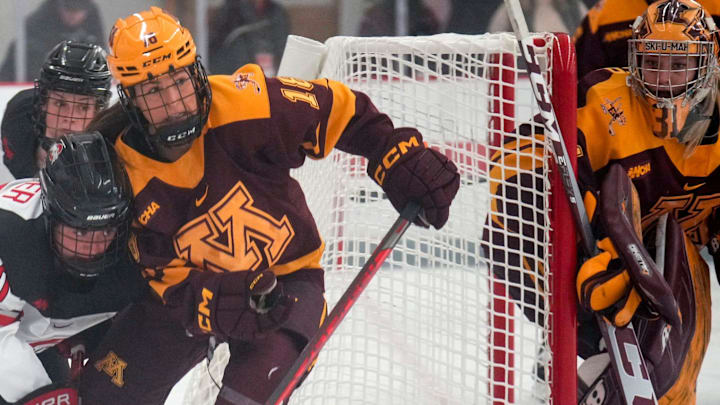 Oct 29, 2022; Columbus, Ohio, USA;  Ohio State University forward Makenna Webster (20) contests the puck with University of Minnesota forward Abbey Murphy (18) during the second period at Ohio State Ice Rink. Mandatory Credit: Joseph Scheller-The Columbus Dispatch

Hockey Osu Women Hockey