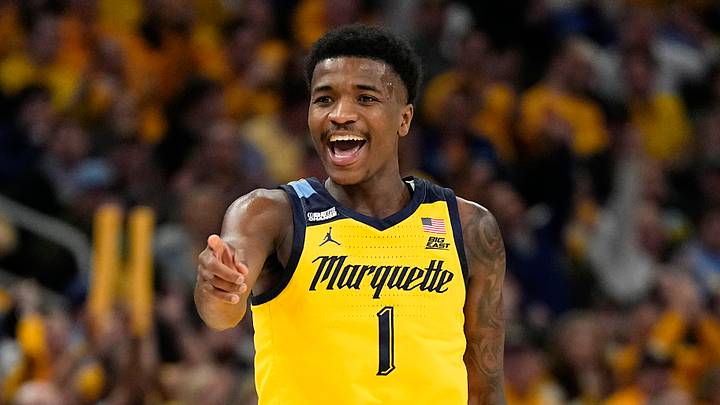 Feb 25, 2024; Milwaukee, Wisconsin, USA;  Marquette Golden Eagles guard Kam Jones (1) reacts after scoring a basket during the second half against the Xavier Musketeers at Fiserv Forum on February 25, 2024.