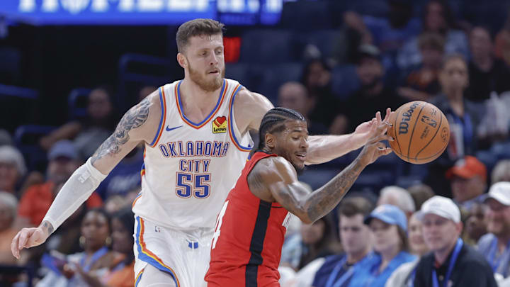 Oct 9, 2024; Oklahoma City, Oklahoma, USA; Oklahoma City Thunder center Isaiah Hartenstein (55) tips the ball away from Houston Rockets guard Jalen Green (4) during the second quarter at Paycom Center. Mandatory Credit: Alonzo Adams-Imagn Images