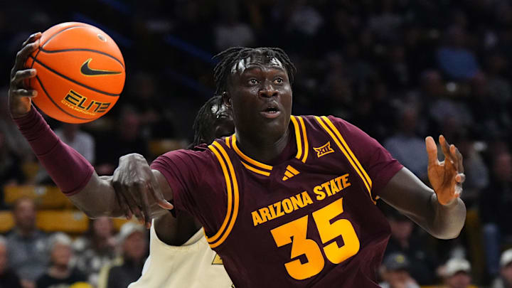Feb 7, 2026; Boulder, Colorado, USA; Colorado Buffaloes forward Bangot Dak (8) fouls Arizona State Sun Devils center Massamba Diop (35) in the first half at the CU Events Center. Mandatory Credit: Ron Chenoy-Imagn Images