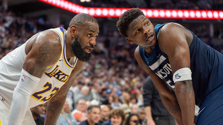 Apr 27, 2025; Minneapolis, Minnesota, USA; Minnesota Timberwolves guard Anthony Edwards (5) guards Los Angeles Lakers forward LeBron James (23) in the second quarter during game four of first round for the 2025 NBA Playoffs at Target Center. Mandatory Credit: Matt Blewett-Imagn Images