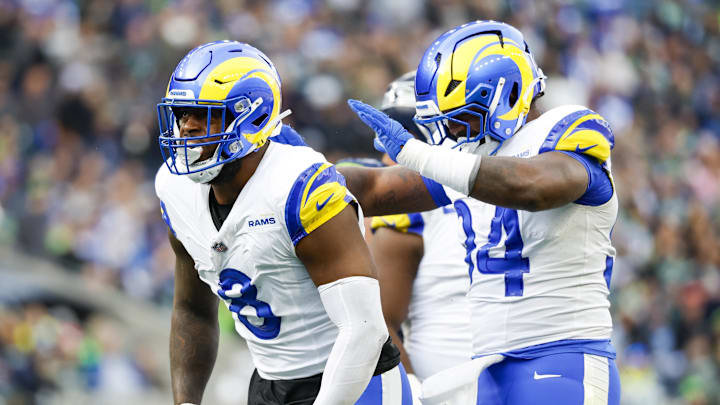 Nov 3, 2024; Seattle, Washington, USA; Los Angeles Rams linebacker Jared Verse (8) celebrates with cornerback Cobie Durant (14) after a sack against the Seattle Seahawks during the second quarter at Lumen Field. Mandatory Credit: Joe Nicholson-Imagn Images