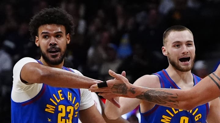 Mar 11, 2026; Denver, Colorado, USA; Denver Nuggets forward Cameron Johnson (23), guard Christian Braun (0) and forward Aaron Gordon (32) reacts in the third quarter against the Houston Rockets at Ball Arena. Mandatory Credit: Ron Chenoy-Imagn Images