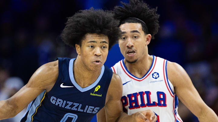 Nov 2, 2024; Philadelphia, Pennsylvania, USA; Memphis Grizzlies forward Jaylen Wells (0) dribbles the ball in front of Philadelphia 76ers guard Jared McCain (20) during the fourth quarter at Wells Fargo Center. Mandatory Credit: Bill Streicher-Imagn Images