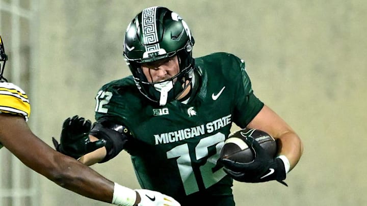 Michigan State's Jack Velling, right, runs after a catch as Iowa's Nick Jackson closes in during the third quarter on Saturday, Oct. 19, 2024, at Spartan Stadium in East Lansing.