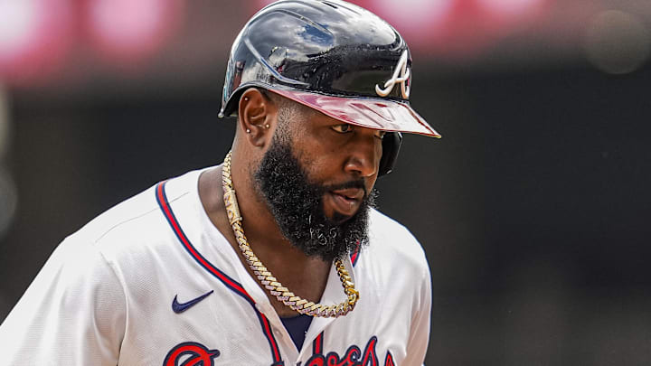 Atlanta Braves designated hitter Marcell Ozuna (20) reacts after hitting a home run against the Washington Nationals during the eighth inning at Truist Park.