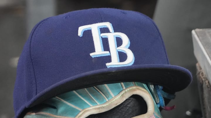 Sep 26, 2025; Toronto, Ontario, CAN; The hat and glove of Tampa Bay Rays third baseman Junior Caminero (13) in the dugout during the game against the Toronto Blue Jays at Rogers Centre. 