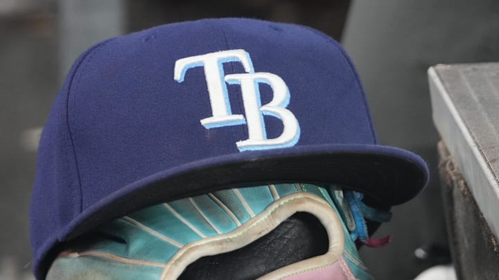 Sep 26, 2025; Toronto, Ontario, CAN; The hat and glove of Tampa Bay Rays third baseman Junior Caminero (13) in the dugout during the game against the Toronto Blue Jays at Rogers Centre. 
