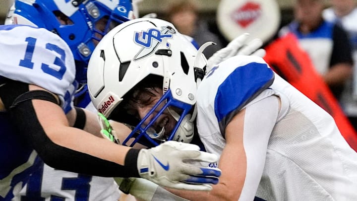 Remsen St. Mary's Dalton Klein (13) hits Gladbrook-Reinbeck’s Hudson Clark (3) during the Iowa high school 8-player championship Thursday, Nov. 21, 2024 at the UNI-Dome in Cedar Falls, Iowa.