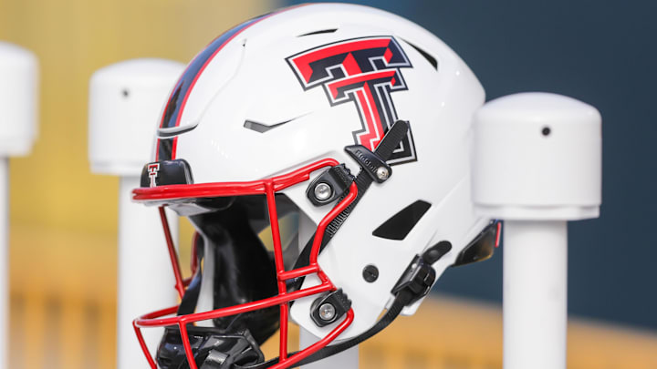 Nov 29, 2025; Morgantown, West Virginia, USA; A Texas Tech Red Raiders helmet sits along the bench area during pregame between the West Virginia Mountaineers and the Texas Tech Red Raiders at Milan Puskar Stadium. 
