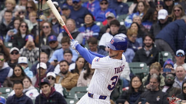 Apr 19, 2025; Chicago, Illinois, USA; Chicago Cubs outfielder Kyle Tucker (30) hits a one run triple against the Arizona Diamondbacks during the first inning at Wrigley Field. Apr 19, 2025; Chicago, Illinois, USA; Chicago Cubs outfielder Kyle Tucker (30) hits a one run triple against the Arizona Diamondbacks during the first inning at Wrigley Field.