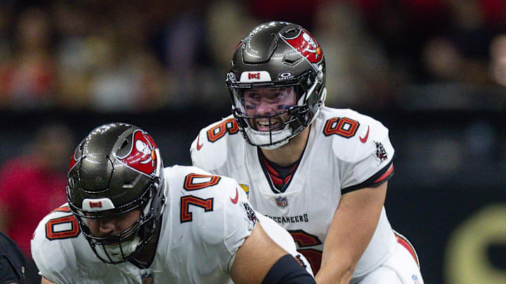 Tampa Bay Buccaneers quarterback Baker Mayfield calls for the ball from center Robert Hainsey.
