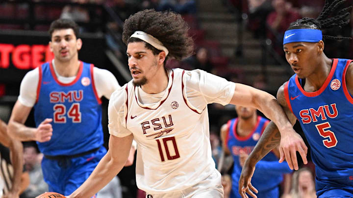 Mar 7, 2026; Tallahassee, Florida, USA; Florida State Seminoles guard Lajae Jones (10) drives the ball up the court past Southern Methodist Mustangs guard Jaron Pierre Jr. (5) during the first half at Donald L. Tucker Center. Mandatory Credit: Melina Myers-Imagn Images