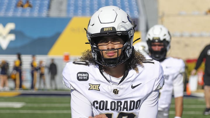 Nov 8, 2025; Morgantown, West Virginia, USA; Colorado Buffaloes quarterback Julian Lewis (10) warms up prior to their game against the West Virginia Mountaineers at Milan Puskar Stadium. Mandatory Credit: Ben Queen-Imagn Images