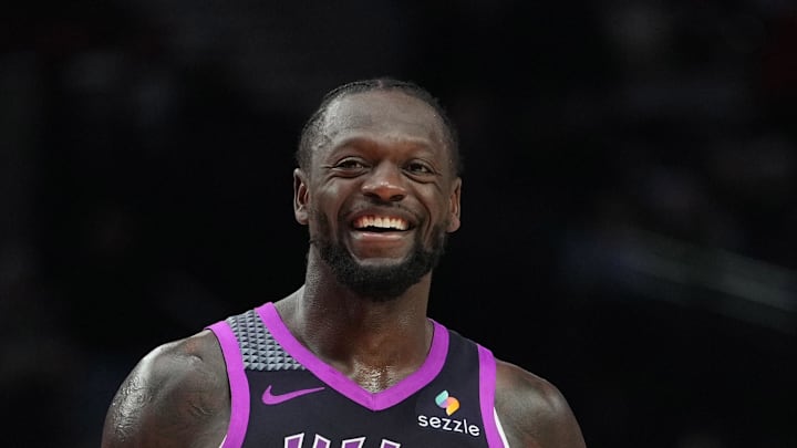 Feb 24, 2026; Portland, Oregon, USA; Minnesota Timberwolves forward Julius Randle (30) and Portland Trail Blazers guard Jrue Holiday (5) share a laugh during the second half at Moda Center. Mandatory Credit: Soobum Im-Imagn Images