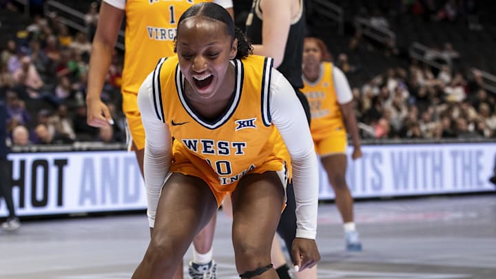Mar 7, 2026; Kansas City, MO, USA; West Virginia Mountaineers guard Jordan Harrison (10) reacts to an and one foul by guard Gia Cooke (3) during the second half at T-Mobile Center. Mandatory Credit: Nick Tre. Smith-Imagn Images Mar 7, 2026; Kansas City, MO, USA; West Virginia Mountaineers guard Jordan Harrison (10) reacts to an and one foul by guard Gia Cooke (3) during the second half at T-Mobile Center. Mandatory Credit: Nick Tre. Smith-Imagn Images