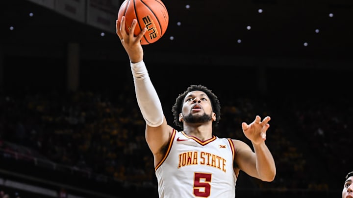 Mar 7, 2026; Ames, Iowa, USA; Iowa State Cyclones forward Joshua Jefferson (5) goes to the basket as Arizona State Sun Devils forward Andrija Grbovic (14) defends during the first half at James H. Hilton Coliseum. 