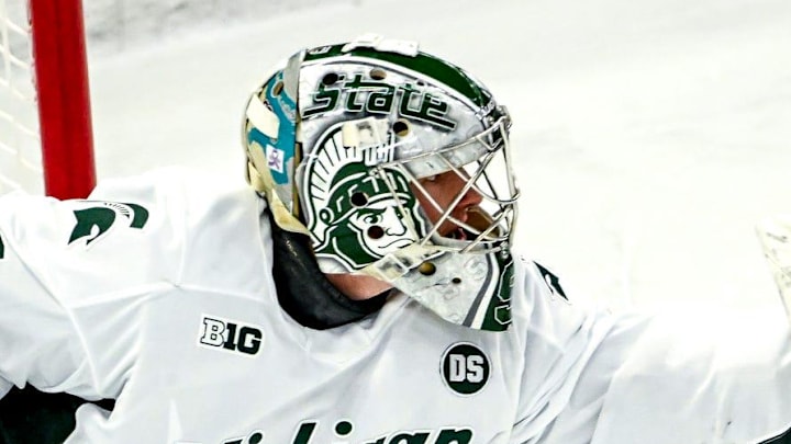 Michigan State's Trey Augustine catches a Minnesota shot during the first period on Friday, Jan. 23, 2026, at Munn Ice Arena in East Lansing.
