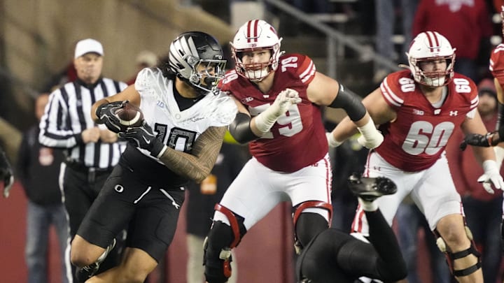 Nov 16, 2024; Madison, Wisconsin, USA;  Oregon Ducks linebacker Matayo Uiagalelei (10) intercepts a pass during the fourth quarter against the Wisconsin Badgers at Camp Randall Stadium. 