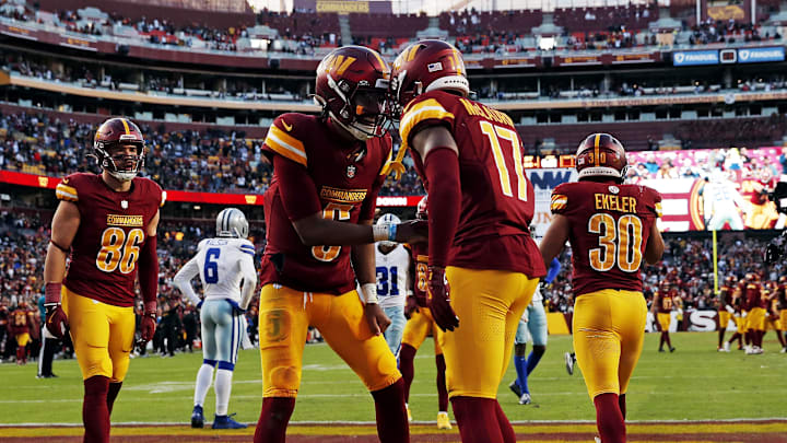 Nov 24, 2024; Landover, Maryland, USA; Washington Commanders wide receiver Terry McLaurin (17) celebrates with quarterback Jayden Daniels (5) after scoring a touchdown during the fourth quarter against the Dallas Cowboys at Northwest Stadium. Mandatory Credit: Peter Casey-Imagn Images Nov 24, 2024; Landover, Maryland, USA; Washington Commanders wide receiver Terry McLaurin (17) celebrates with quarterback Jayden Daniels (5) after scoring a touchdown during the fourth quarter against the Dallas Cowboys at Northwest Stadium. Mandatory Credit: Peter Casey-Imagn Images