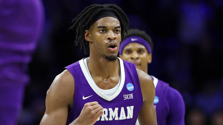 Former Furman Paladins forward Cooper Bowser (21) reacts in the first half during a first round game of the men's 2026 NCAA Tournament at Xfinity Mobile Arena. Former Furman Paladins forward Cooper Bowser (21) reacts in the first half during a first round game of the men's 2026 NCAA Tournament at Xfinity Mobile Arena.