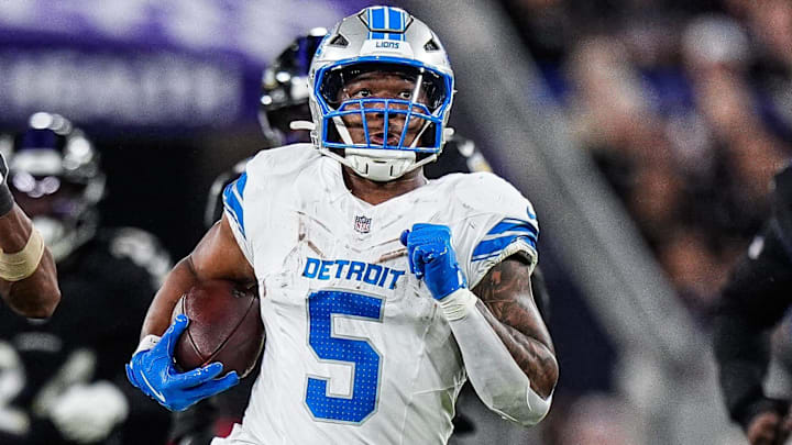 Detroit Lions running back David Montgomery (5) runs against Baltimore Ravens cornerback Marlon Humphrey (44) 