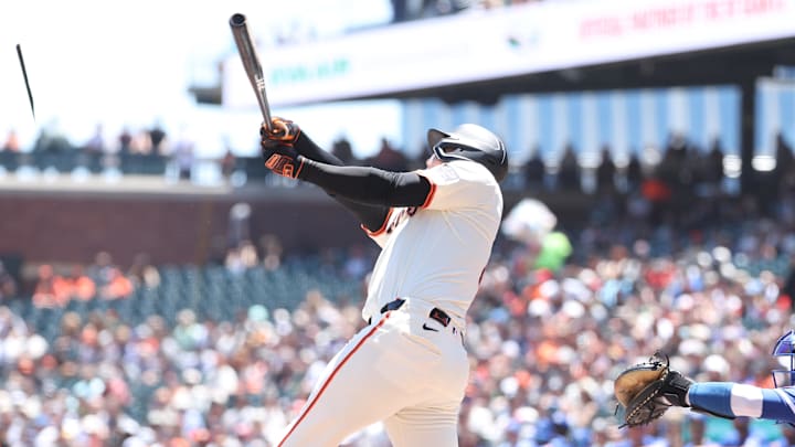 May 21, 2025; San Francisco, California, USA; San Francisco Giants designated hitter Wilmer Flores (41) splits his bat during the first inning against the Kansas City Royals at Oracle Park. 