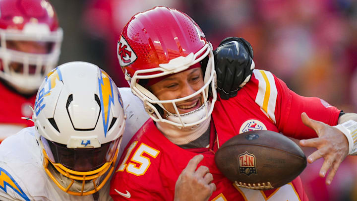 Dec 14, 2025; Kansas City, Missouri, USA; Kansas City Chiefs quarterback Patrick Mahomes (15) is sacked by Los Angeles Chargers linebacker Odafe Oweh (98) during the second half at GEHA Field at Arrowhead Stadium. Mandatory Credit: Jay Biggerstaff-Imagn Images Dec 14, 2025; Kansas City, Missouri, USA; Kansas City Chiefs quarterback Patrick Mahomes (15) is sacked by Los Angeles Chargers linebacker Odafe Oweh (98) during the second half at GEHA Field at Arrowhead Stadium. Mandatory Credit: Jay Biggerstaff-Imagn Images
