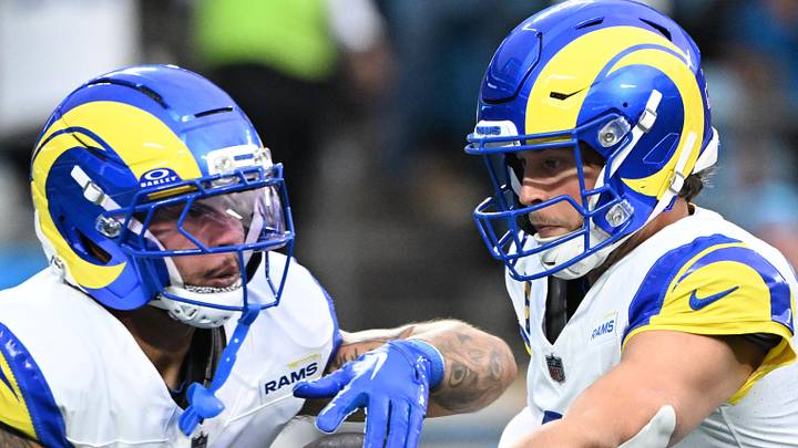 Los Angeles Rams quarterback Matthew Stafford (9) hands the ball off to running back Blake Corum (22). Mandatory Credit: Bob Donnan-Imagn Images