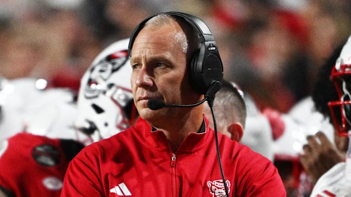Nov 1, 2025; Raleigh, North Carolina, USA;  NC State Wolfpack head coach Dave Doeren during the first quarter at Carter-Finley Stadium. Mandatory Credit: Zachary Taft-Imagn Images