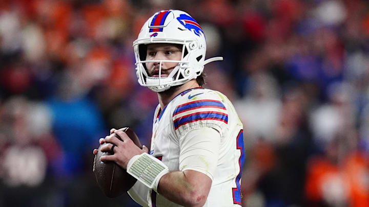 Jan 17, 2026; Denver, CO, USA; Buffalo Bills quarterback Josh Allen (17) drops to throw during the fourth quarter of an AFC Divisional Round playoff game against the Denver Broncos at Empower Field at Mile High. Mandatory Credit: Ron Chenoy-Imagn Images