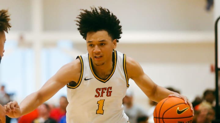 Team SFG’s Brayden Burries (1) looks to make a play against Team Boo Williams during the Nike Elite Youth Basketball League session one on Friday, April 26, 2024 at the Memphis Sports & Event Center in Memphis, Tenn.