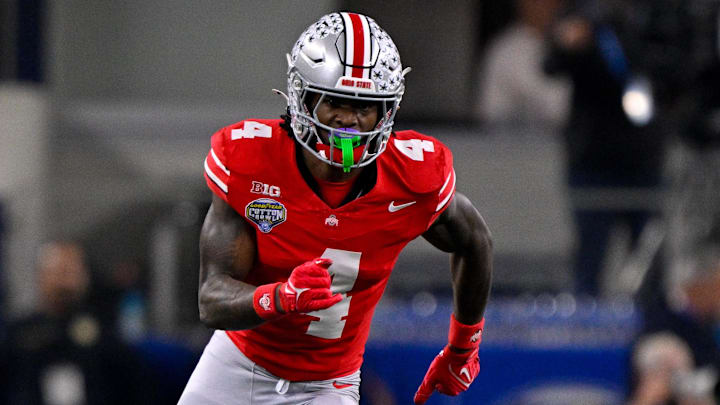 Jan 10, 2025; Arlington, TX, USA; Ohio State Buckeyes wide receiver Jeremiah Smith (4) in action during the game between the Texas Longhorns and the Ohio State Buckeyes at AT&T Stadium. Mandatory Credit: Jerome Miron-Imagn Images
