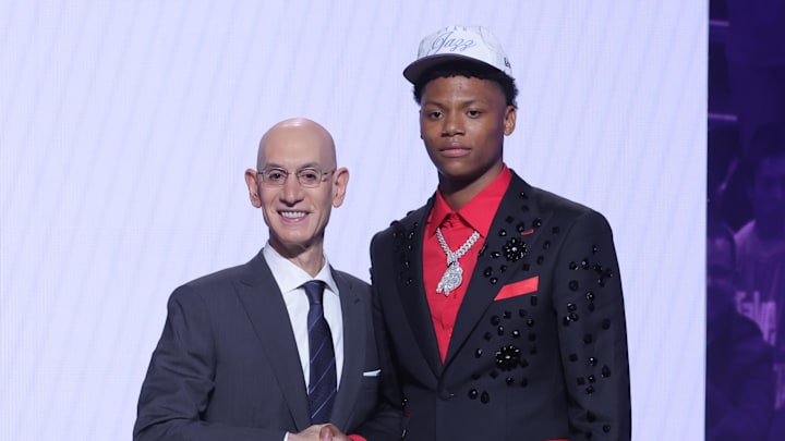 Jun 25, 2025; Brooklyn, NY, USA;  Ace Bailey stands with NBA commissioner Adam Silver after being selected as the fifth pick by the Utah Jazz in the first round of the 2025 NBA Draft at Barclays Center. Mandatory Credit: Brad Penner-Imagn Images