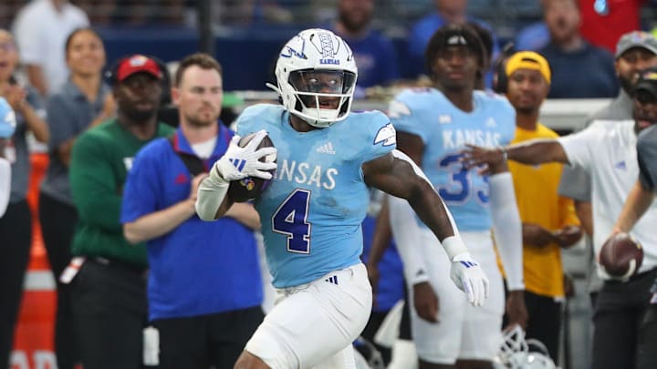 Kansas Jayhawks running back Devin Neal (4) runs the ball against Lindenwood Lions in the second quarter of the game Thursday, August 29, 2024 at Children's Mercy Park. Kansas Jayhawks running back Devin Neal (4) runs the ball against Lindenwood Lions in the second quarter of the game Thursday, August 29, 2024 at Children's Mercy Park.