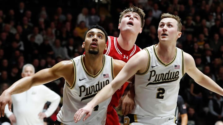 Purdue Boilermakers forward Trey Kaufman-Renn (4) and Purdue Boilermakers guard Fletcher Loyer (2) box out Wisconsin Badgers forward Nolan Winter (31) Saturday, Feb. 15, 2025, during the NCAA men’s basketball game at Mackey Arena in West Lafayette, Ind.