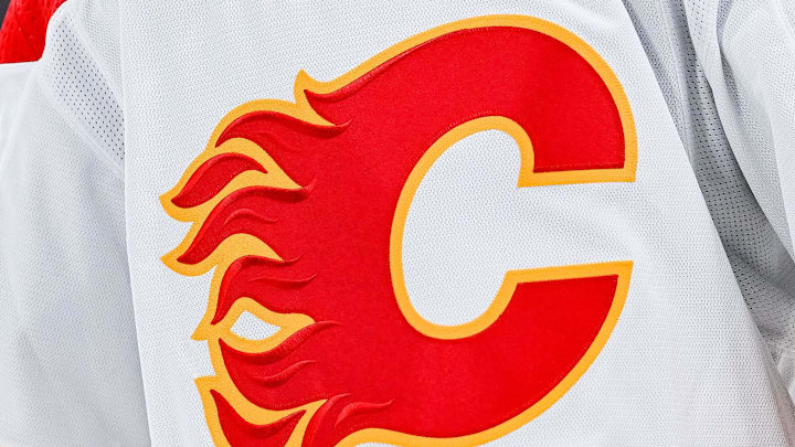 Dec 12, 2022; Montreal, Quebec, CAN; View of a Calgary Flames logo on a jersey worn by the member of the team during the second period at Bell Centre. Mandatory Credit: David Kirouac-Imagn Images