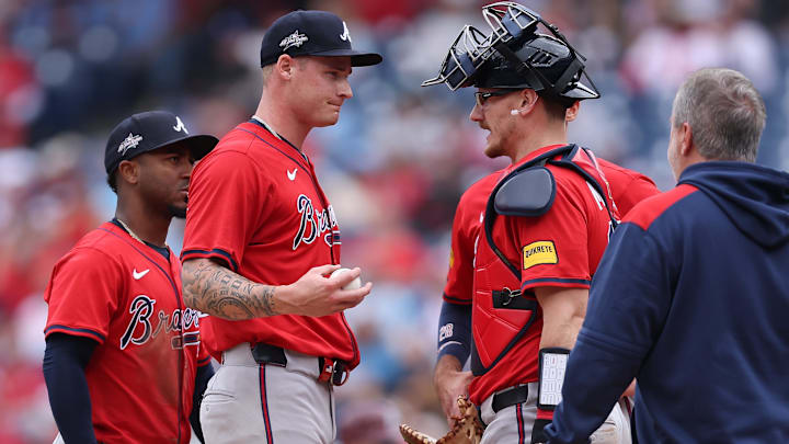 May 29, 2025; Philadelphia, Pennsylvania, USA; Atlanta Braves pitcher AJ Smith-Shawver (32) talks with catcher Sean Murphy (12) before leaving the game during the third inning against the Philadelphia Phillies at Citizens Bank Park. Mandatory Credit: Bill Streicher-Imagn Images