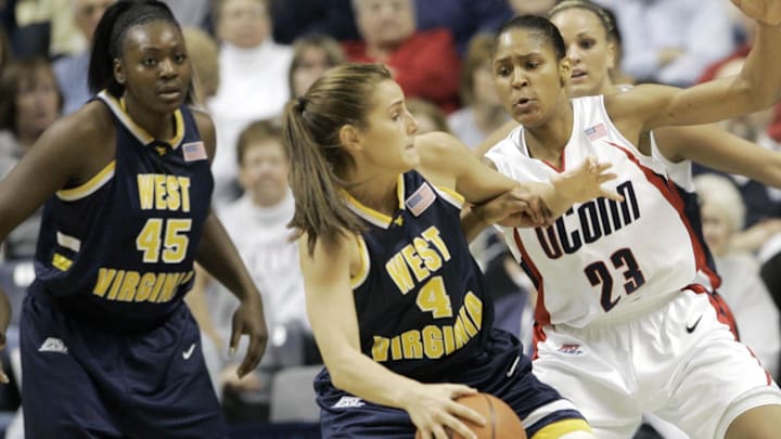 Jan 9, 2008; Storrs, CT, USA; Connecticut Huskies forward Maya Moore (23) defends against West Virginia Mountaineers forward Meg Bulger (4) in the 1st half at Gampel Pavilion. Mandatory Credit: David Butler II-Imagn Images Jan 9, 2008; Storrs, CT, USA; Connecticut Huskies forward Maya Moore (23) defends against West Virginia Mountaineers forward Meg Bulger (4) in the 1st half at Gampel Pavilion. Mandatory Credit: David Butler II-Imagn Images