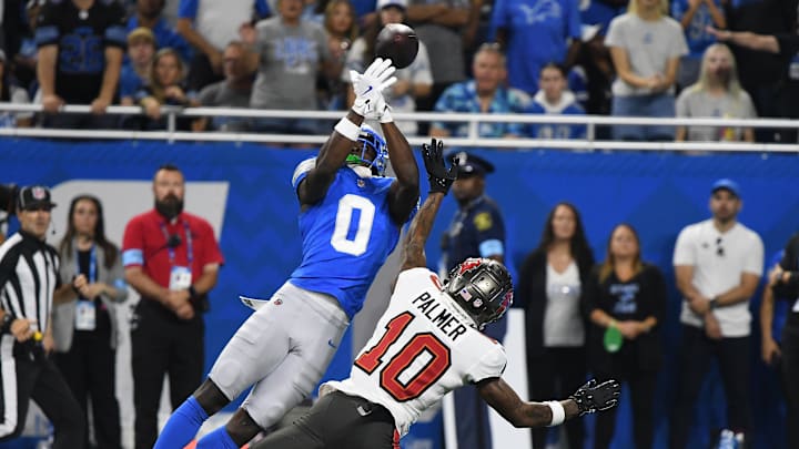 Detroit Lions cornerback Terrion Arnold (0) breaks up a pass intended for Buccaneers wide receiver Trey Palmer (10) 