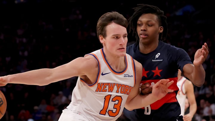 Nov 18, 2024; New York, New York, USA; New York Knicks guard Tyler Kolek (13) drives to the basket against Washington Wizards guard Carlton Carrington (8) during the fourth quarter at Madison Square Garden. Mandatory Credit: Brad Penner-Imagn Images
