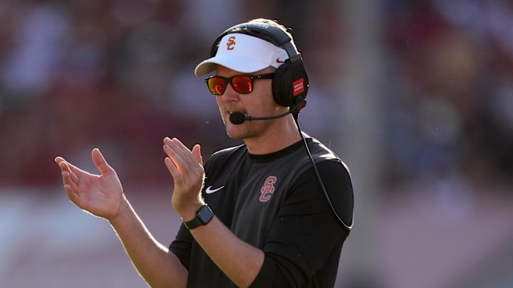 Aug 30, 2025; Los Angeles, California, USA; Southern California Trojans head coach Lincoln Riley watches from the sidelines against the Missouri State Bears in the first half at United Airlines Field at Los Angeles Memorial Coliseum. Mandatory Credit: Kirby Lee-Imagn Images