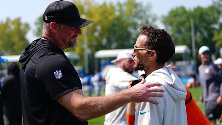Detroit Lions coach Dan Campbell shakes hands with former Miami Dolphins coach Mike McDaniels after a joint practice at Lions headquarters and training facility in Allen Park, Thursday, Aug. 14, 2025. Detroit Lions coach Dan Campbell shakes hands with former Miami Dolphins coach Mike McDaniels after a joint practice at Lions headquarters and training facility in Allen Park, Thursday, Aug. 14, 2025.