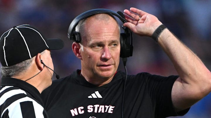 Sep 20, 2025; Durham, North Carolina, USA; NC State Wolfpack head coach Dave Doeren reacts to a call during the fourth quarter against the Duke Blue Devils at Wallace Wade Stadium. Mandatory Credit: Zachary Taft-Imagn Images Sep 20, 2025; Durham, North Carolina, USA; NC State Wolfpack head coach Dave Doeren reacts to a call during the fourth quarter against the Duke Blue Devils at Wallace Wade Stadium. Mandatory Credit: Zachary Taft-Imagn Images