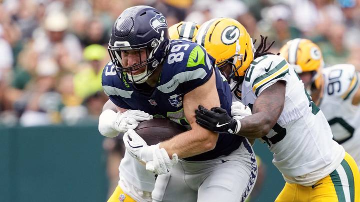 Aug 23, 2025; Green Bay, Wisconsin, USA;  Seattle Seahawks tight end Nick Kallerup (89) is tackled after catching a pass during the first quarter against the Green Bay Packers at Lambeau Field. Mandatory Credit: Jeff Hanisch-Imagn Images