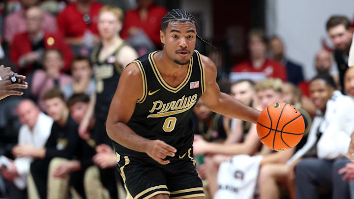 Purdue Boilermakers guard C.J. Cox (0) dribbles against the Alabama Crimson Tide.