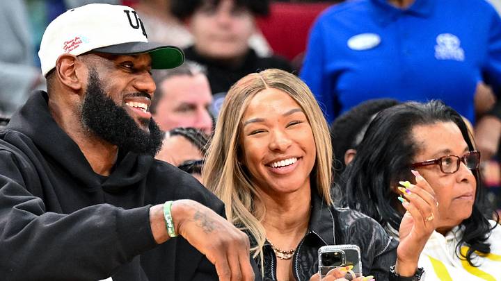Mar 28, 2023: Los Angeles Laker LeBron James and his wife Savannah James sit court side at the McDonald's All American game during the first half at Toyota Center in Houston, TX.