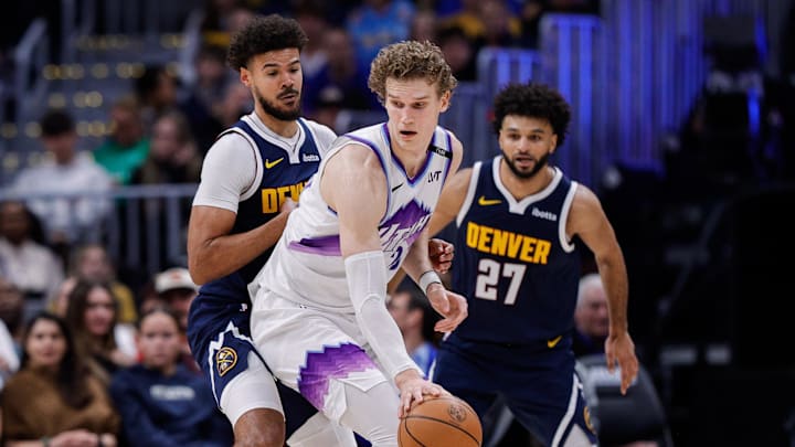 Dec 22, 2025; Denver, Colorado, USA; Utah Jazz forward Lauri Markkanen (23) controls the ball under pressure from Denver Nuggets forward Cameron Johnson (23) as guard Jamal Murray (27) defends in the third quarter at Ball Arena. Mandatory Credit: Isaiah J. Downing-Imagn Images Dec 22, 2025; Denver, Colorado, USA; Utah Jazz forward Lauri Markkanen (23) controls the ball under pressure from Denver Nuggets forward Cameron Johnson (23) as guard Jamal Murray (27) defends in the third quarter at Ball Arena. Mandatory Credit: Isaiah J. Downing-Imagn Images