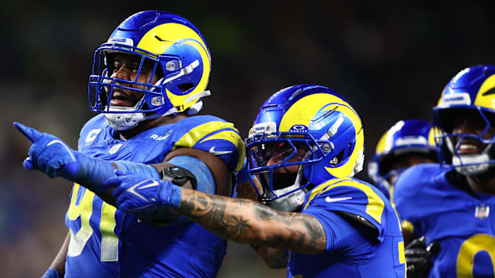 Dec 18, 2025; Seattle, Washington, USA; Los Angeles Rams defensive end Kobie Turner (91) celebrates after an interception against the Seattle Seahawks in the second half at Lumen Field. Mandatory Credit: Kevin Ng-Imagn Images Dec 18, 2025; Seattle, Washington, USA; Los Angeles Rams defensive end Kobie Turner (91) celebrates after an interception against the Seattle Seahawks in the second half at Lumen Field. Mandatory Credit: Kevin Ng-Imagn Images